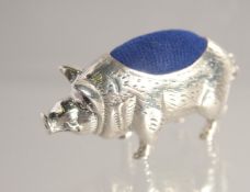 A SILVER HOG PIN CUSHION.