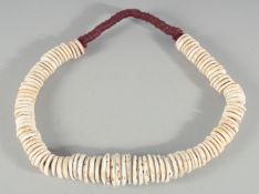 A NEW GUINEA CURRENCY NECKLACE.