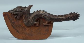 A TIBETAN BRONZE DRAGON AXE. 13ins long.