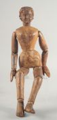 A RARE WOODEN SEGMENTED FIGURE OF A GIRL. 19ins long.