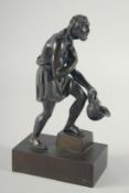 A GOOD GRAND TOUR BRONZE FIGURE OF A MAN holding a helmet. 8.5ins high.