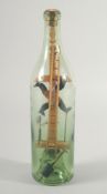 A FOLK ART MAN IN A BOTTLE. 11ins high.