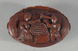 A GOOD CARVED COQUILLA NUT SNUFF BOX. 2.75ins.