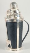 A SILVER PLATED GOLF COCKTAIL SHAKER.