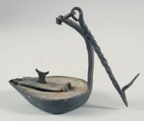 AN EARLY 19TH CENTURY METAL WHALE OIL LAMP.