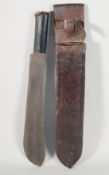 A WORLD WAR II BOLO MACHETE with an original leather scabbard.