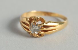 AN 18CT GOLD DIAMOND RING.