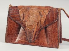 A 1940's - 1950's CUBAN ALLIGATOR SKIN AND HEAD HANDBAG, the fold over flap with alligator head,