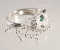 A SILVER PANTHER TASSEL RING.
