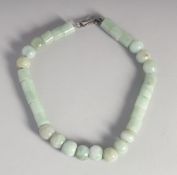 A GREY JADE NECKLACE.
