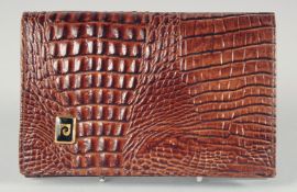 A 1940's - 1950's BROWN CROCODILE SKIN PURSE. 6ins long, 4ins deep.
