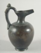 A SMALL GRAND TOUR BRONZE EWER with classical figures handle. 4.75ins high.