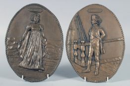 A PAIR OF BRONZED OVAL PLAQUES, LORD NELSON AND LADY HAMILTON. Signed J. N.