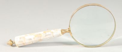 A MAGNIFYING GLASS with mother of pearl handle.