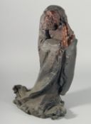 AN ABSTRACT BRONZE OF A SAGE. 21ins high.