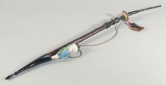 A BAVARIAN PORCELAIN AND WOOD LONG PIPE.