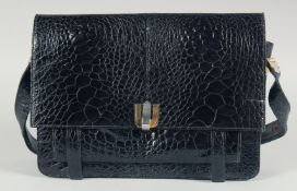A 1950's - 1960's BLACK CROCODILE SKIN HANDBAG with iron numbers and long extending crocodile skin
