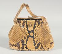 A 1940's - 1950's SNAKESKIN HANDBAG two colour, brown mounts, suede interior and two handles. 6ins