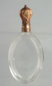 AN 18CT GOLD TOP GLASS SCENT BOTTLE in a leather case.