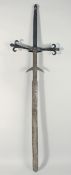 A LARGE RARE 16TH - 17TH CENTURY GERMAN LONG SWORD with leather handle. 55ins long.