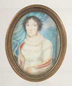 AN OVAL MINIATURE OF A LADY. 2.25ins x 1.75ins