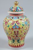 A CHINESE FAMILLE JAUNE PORCELAIN CIRCULAR VASE AND COVER 9ins diameter.