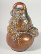 A CARVED HORN GOURD SCROLL WEIGHT 5.5ins high.