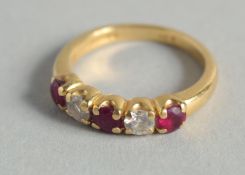 AN 18CT GOLD, DIAMOND AND RUBY RING.