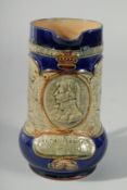 A ROYAL DOULTON STONEWARE JUG decorated with Lord Nelson and ships. “Born 1758, Died 1805.” “England