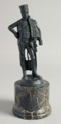A BRONZE FIGURE AS A HUSSAR. 7ins on a marble plinth.