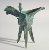 A CHINESE BRONZE EWER. 7.5ins high.