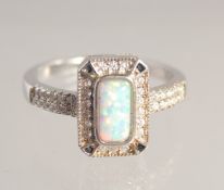 A SILVER AND GILSON OPAL DECO STYLE RING.