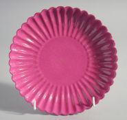 A CHINESE PETAL SHAPED PINK PORCELAIN DISH. 7ins diameter.