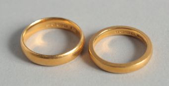 TWO 22CT GOLD WEDDING BANDS. 12.4gms.