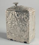 A DUTCH SILVER TEA CADDY with a sliding cover, repousse with figures and scrolls. English Imperial