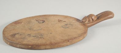 A MOUSEMAN CARVED WOOD CHEESE PLATTER. Signed with a number on the handle. 13.5ins long.