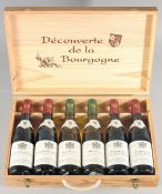 DOMAIN DU CHATEAU DE MEURSAULT, a wooden presentation case containing 4 half bottles of red wine and