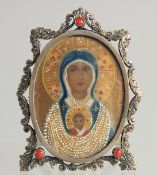 A SMALL SILVER OVAL ICON. 2.25ins.