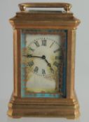 A SEVRES MINI BRASS CARRIAGE CLOCK with porcelain panels. 3ins high.