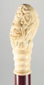 A CARVED BONE HANDLE WALKING STICK 