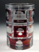 A GOOD CONTINENTAL RUBY TINTED GLASS BEAKER with engraved panels of buildings 4.5ins high.