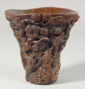 A CARVED HORN LIBATION CUP. 5.5ins high.