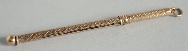 A 9CT GOLD CHAMPAGNE SWIZZLE STICK.