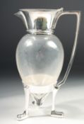 A CHRISTOPHER DRESSER DESIGN SILVER PLATED CLARET JUG on three crow’s feet.