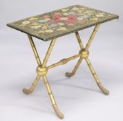 A VICTORIAN RECTANGULAR OCCASIONAL TABLE with a floral embroidered top, on faux bamboo and gilded