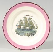 A GRAYS POTTERY PLATE DECORATED WITH A SAILING SHIP. 10ins diameter.