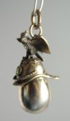 A RUSSIAN SILVER EGG AND HELMET PENDANT.