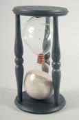 A LARGE WOODEN SAND TIMER. 8ins high.
