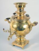 A SMALLER 19TH CENTURY RUSSIAN BRASS SAMOVAR with a pair of carrying handles, spout, on a square