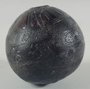 AN 1800'S CARVED COCONUT FLASK. 5.5ins.